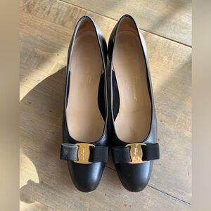 Salvatore Ferragamo black pumps. Bow with Gold Buckle.